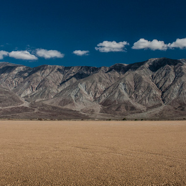 Beautiful mountains and a deep blue sky over a dry lake bed